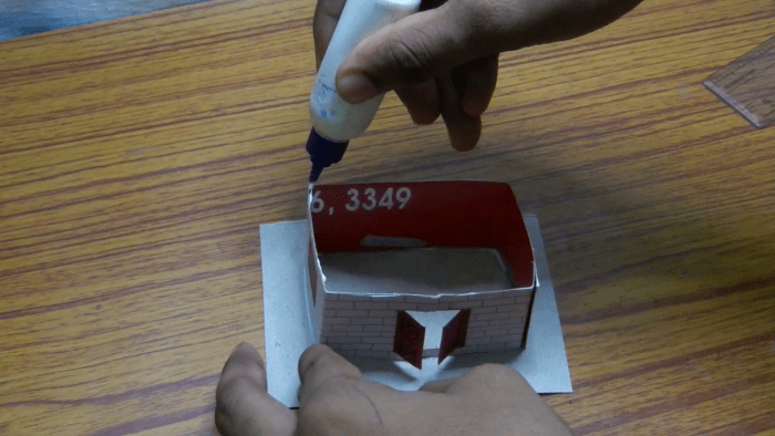 Apply glue on the upper portion of the wall. I would suggest that you use a quick fixing glue for this craft.