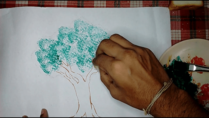 Step 6- use the bread to make designs of the tree leaves by softly tapping it on the drawing paper. Remember to repeatedly change the bread pieces after their usage to ensure good patterns for the leaves.