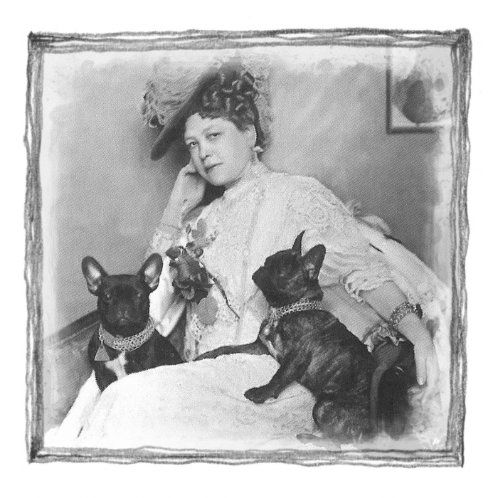 A photo of Esther Flint with her two French Bulldogs. Esther lived in our house but died in the early 1900s.