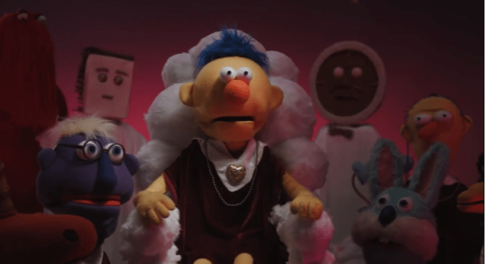 The return of all familiar faces in their ritualistic robes to bring in the yellow guy to their group