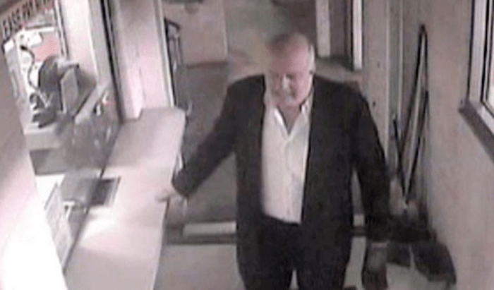 John P. Wheeler on video surveillance walking without his coat and carrying one shoe in the Hotel DuPont parking area. Photo courtesy of Newsweek.