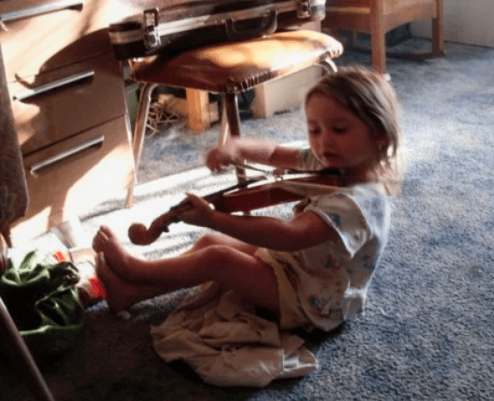 At this age, stuffed animals, violins, and toads all mix beautifully in an afternoon's play. And don't forget the blankie.