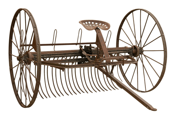 This is a hay rake. It was used after the hay cutter (top photo) had cut down a field of hay and the farmer raked the hay in straight rows for it to be baled.