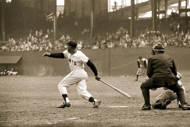 Mays at the Polo Grounds early 50s. You can get a sense of the odd shape and antiquated nature of the facility from this angle. The bullpens were actually in fair territory.