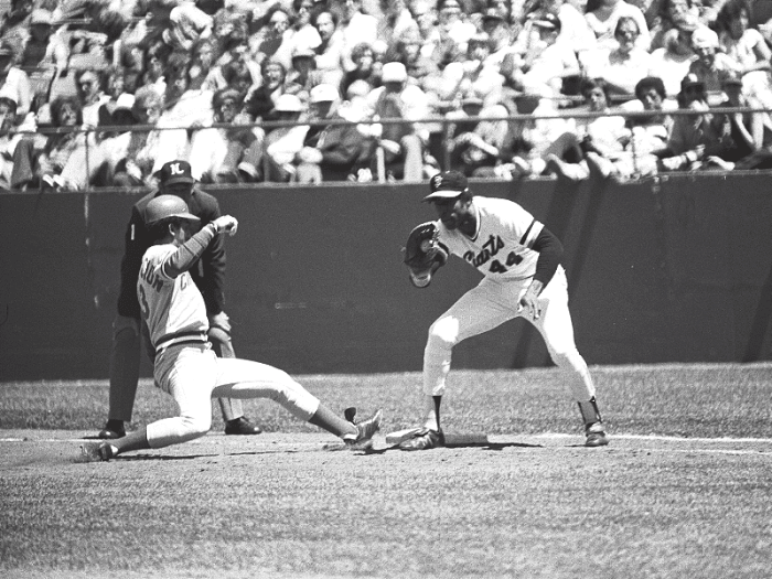 Former San Francisco Giants first baseman Willie McCovey takes a throw at first base against the Cincinnati Reds late in the 1980 season—his last year before retiring.
