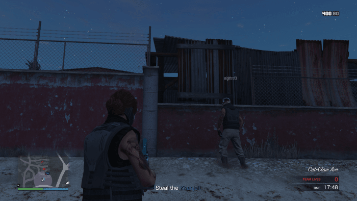The "hole" in the enemy's defense along the wall. A Sticky Bomb will blast that piece of sheet metal away.