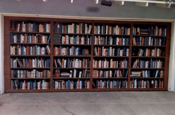 This is the garage door of former writer for the LA Times, Lee Dembart. Dembart loves books so much he had this trompe-l'oeil painted by artist Don Gray in 2005.