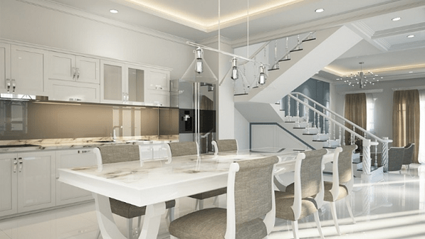 A beautiful contemporary minimalist theme interior of a residential home. Its design shows how a kitchen space and dining area flow into each other