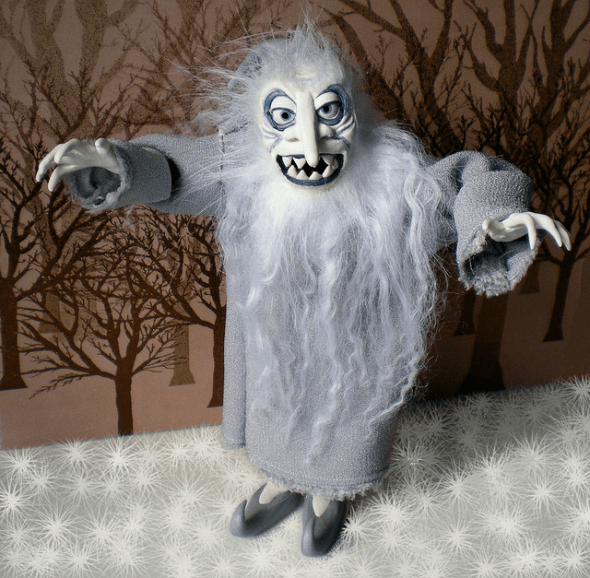 Winter Warlock is made of polymer clay with a foil and wire armature, and has been painted with acrylic paints. The hair is a mixture of Tibetan lambswool and polyester fur.