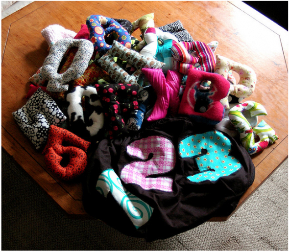 A complete set of sewn softie letters with a handmade drawstring bag. This would make a wonderful baby shower gift!