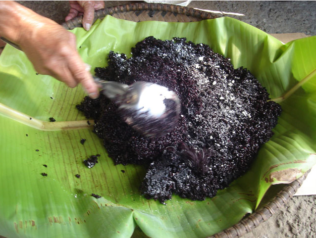 Mix the cooked rice to distribute the bubod (Image Credit: Photos by Jun Verzola and Brenda Dacpano/NORDIS from galleries.nordis.net)