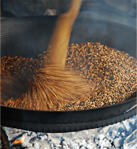 Roasting the rice grains for 30 minutes or until the grains turned to golden brown (Image Credit: AkosiSuperEdwinK from pinoyphotography.org)