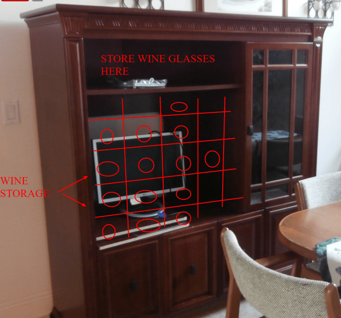 Get an insert to covert the large opening into a wine rack or if you do woodworking, make that yourself.