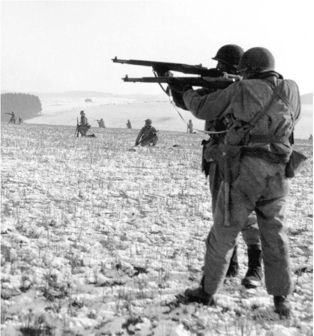 Infantry men of the Third Army battling to releive the men of the 101st Airborne in Bastogne.