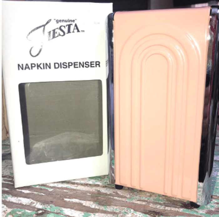 peach Napkin holder was created under license. This diner style napkin holder goes "with" the peach that was mfg. from 1986-1998 . Expect to pay $50-$100 for these now.