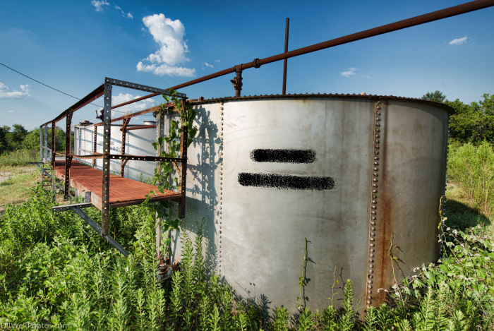 Abandoned oil well tanks such as this one pose a danger to children and wildlife, which may fall in and become trapped.
