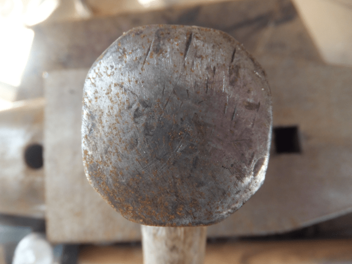 Damage at 12 o'clock and 2 o'clock position of blacksmith hammer. This hammer needs to be redressed.