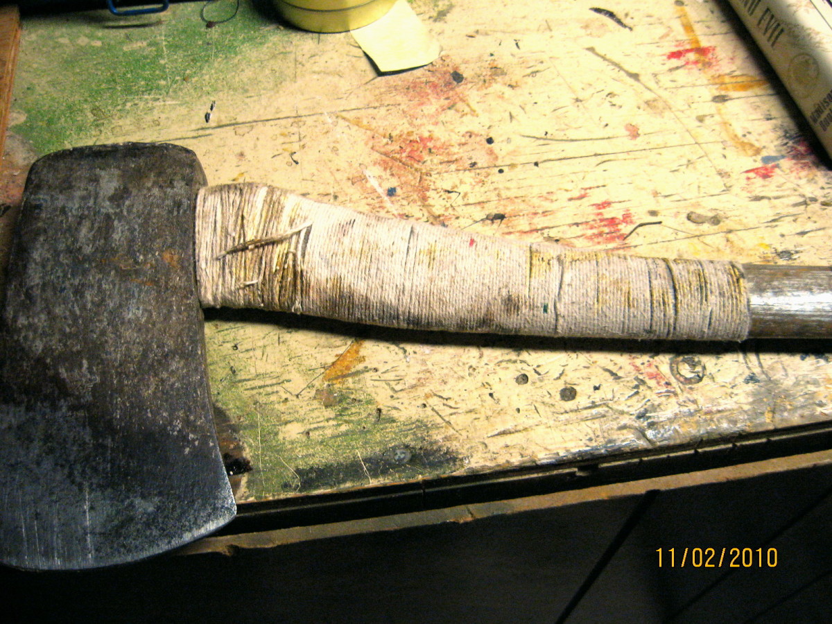 Axe handle with an old repair