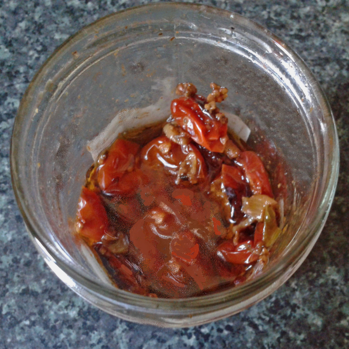 Oven-baked baby tomatoes in a jar
