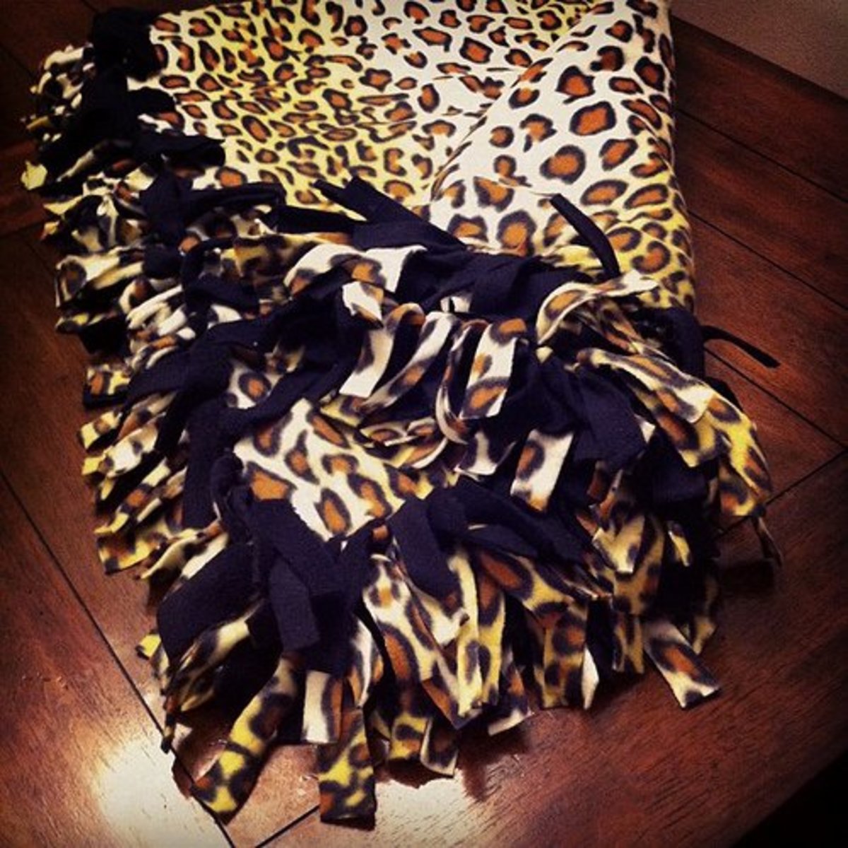 Leopard print fleece tie blanket