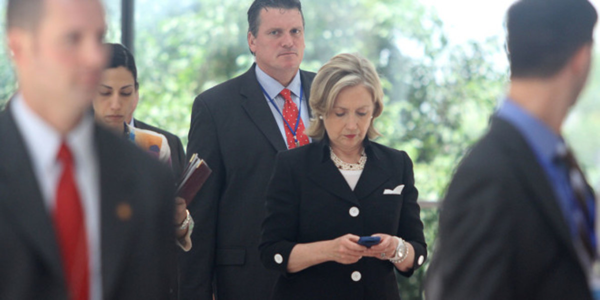 Beckel with Clintonj in 2012, while she was Secretary of State