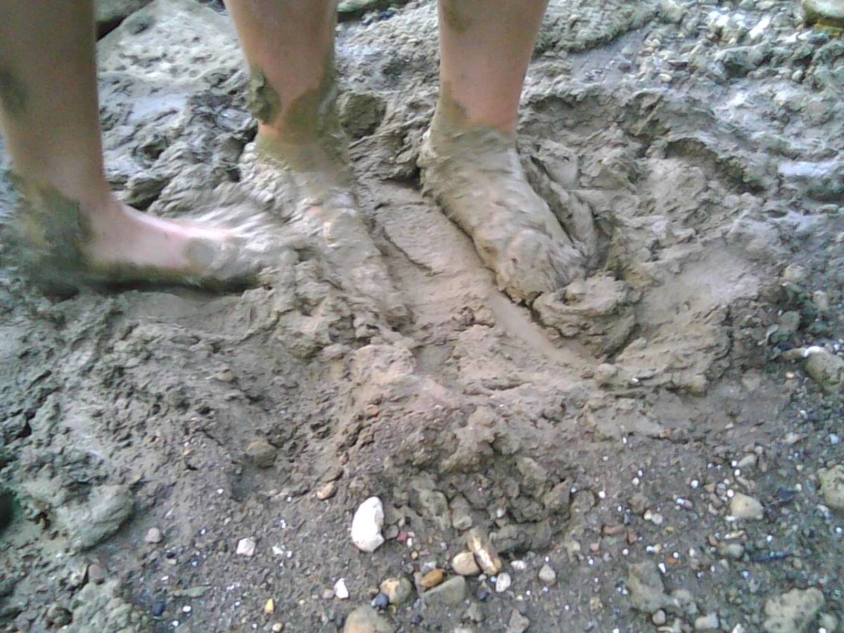 Walk barefoot! Enjoy squishing in the mud!