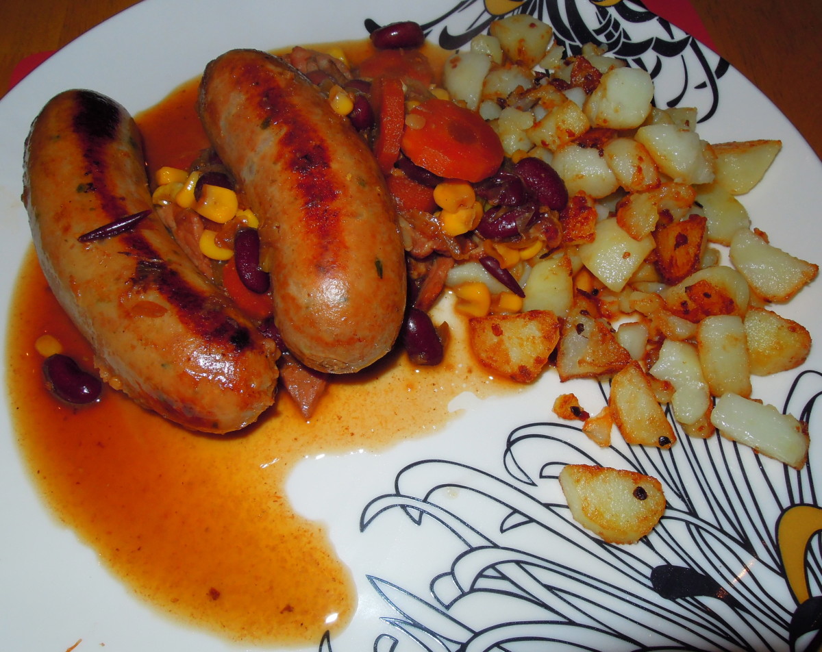 The best Sausage Casserole done in the slow cooker, served with garlic sauté potatoes