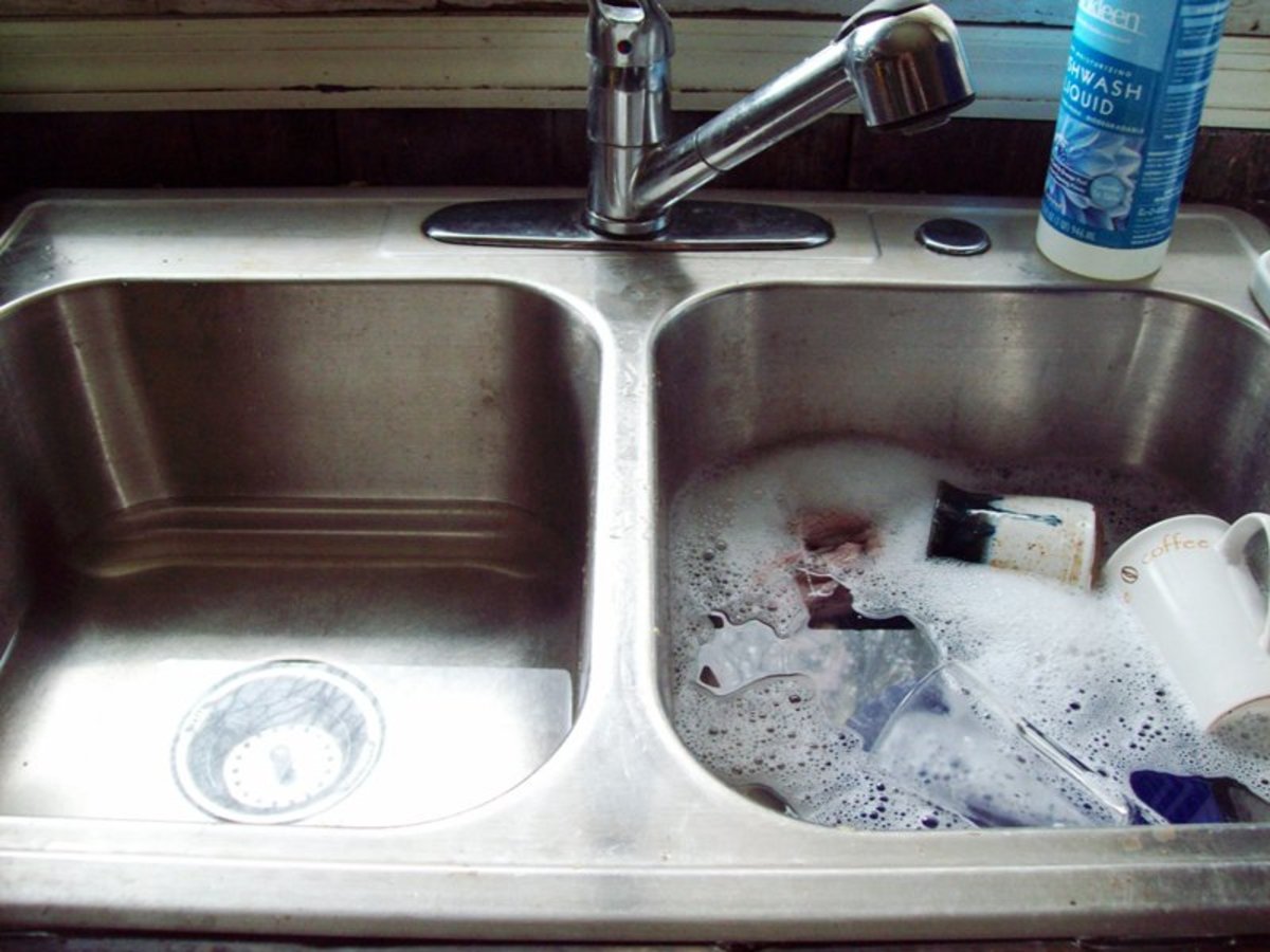 A picture of my sink.  One side has the dishes all "soaped" up.  The other side has some hot water in it for rinsing.  Incredibly, doing dishes this way saves water, energy, AND time!