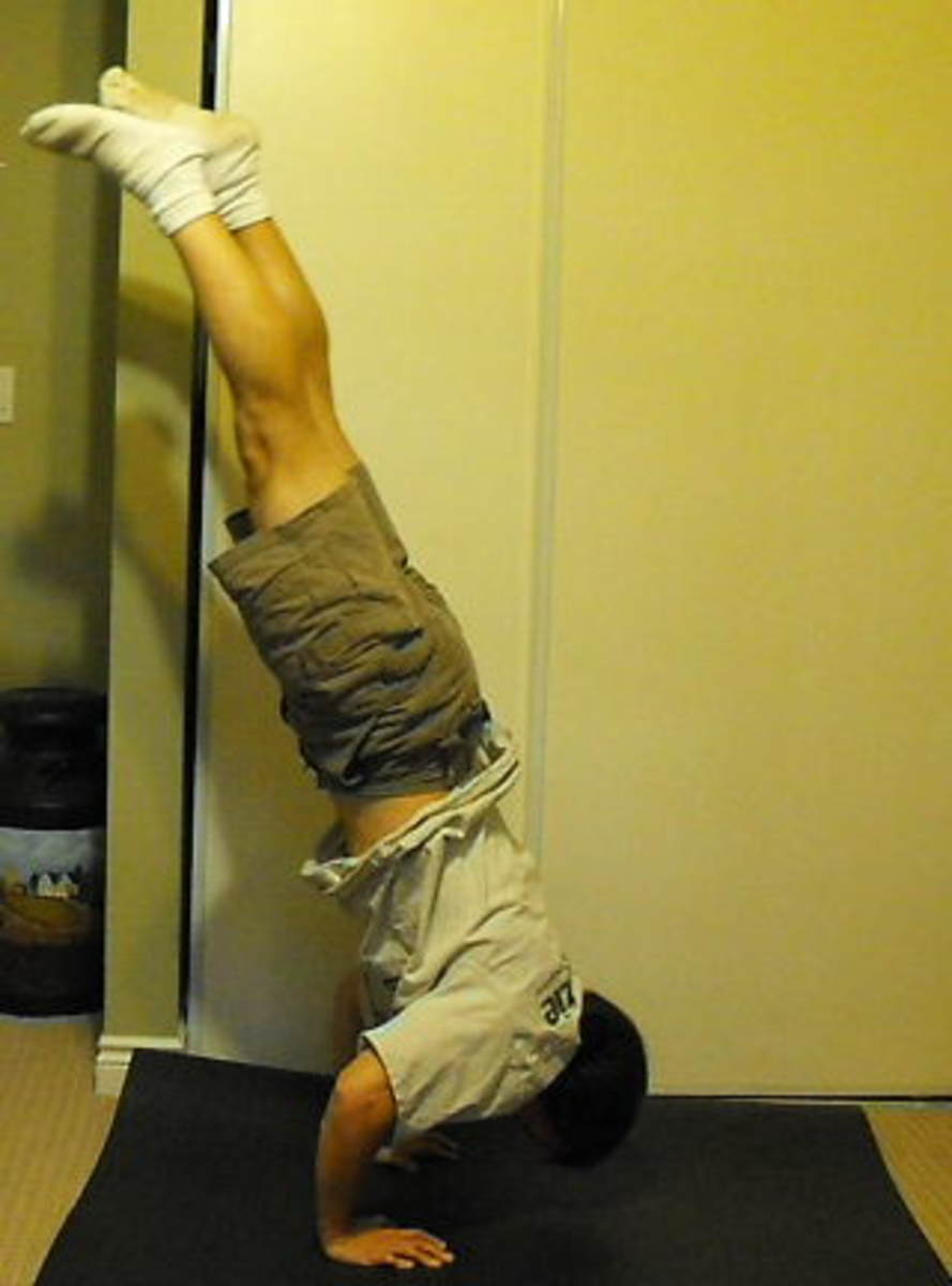 Attempting a handstand push-up.