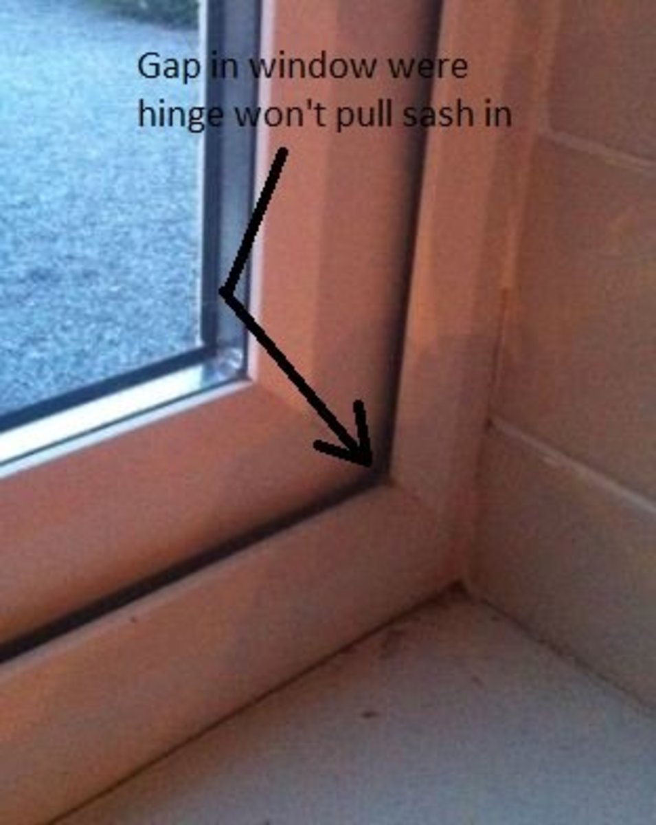 Gap in window where hinge won't close the sash fully.