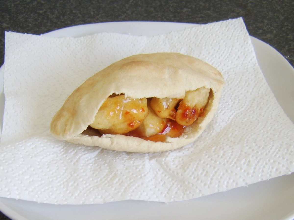 Chicken and pineapple fritters served in a pitta bread pocket with sweet chilli sauce