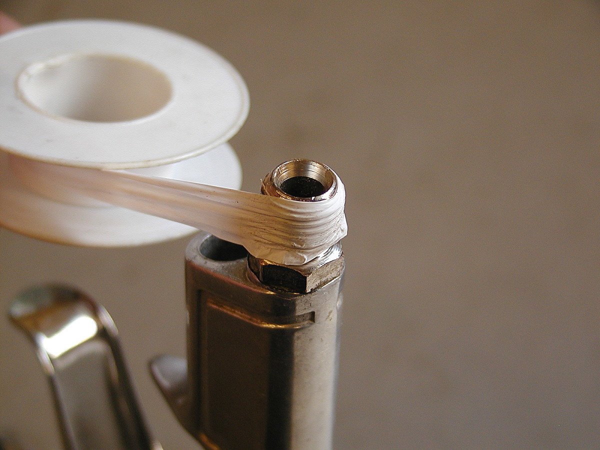 Wind the PTFE tape tightly in a clockwise direction down the length of the threads. Apply a few layers of tape