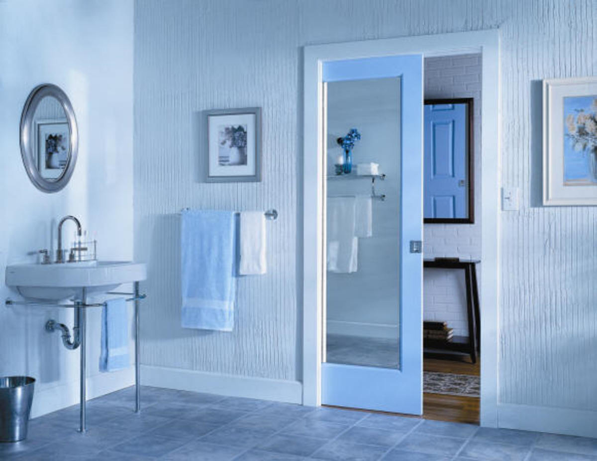 For small bathrooms, pocket doors are becoming more and more utilized as a space saving door.