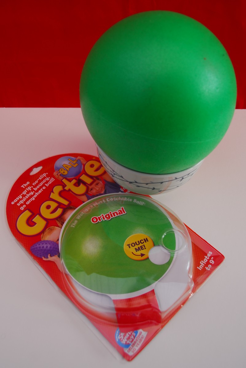 A 9 inch Gertie Ball inflated and set into a small bowl.