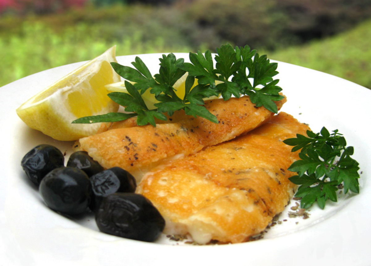 My saganaki photo. Notice I've placed parsley, lemon and olives on the plate as well as sprinkling it with dried mixed herbs.