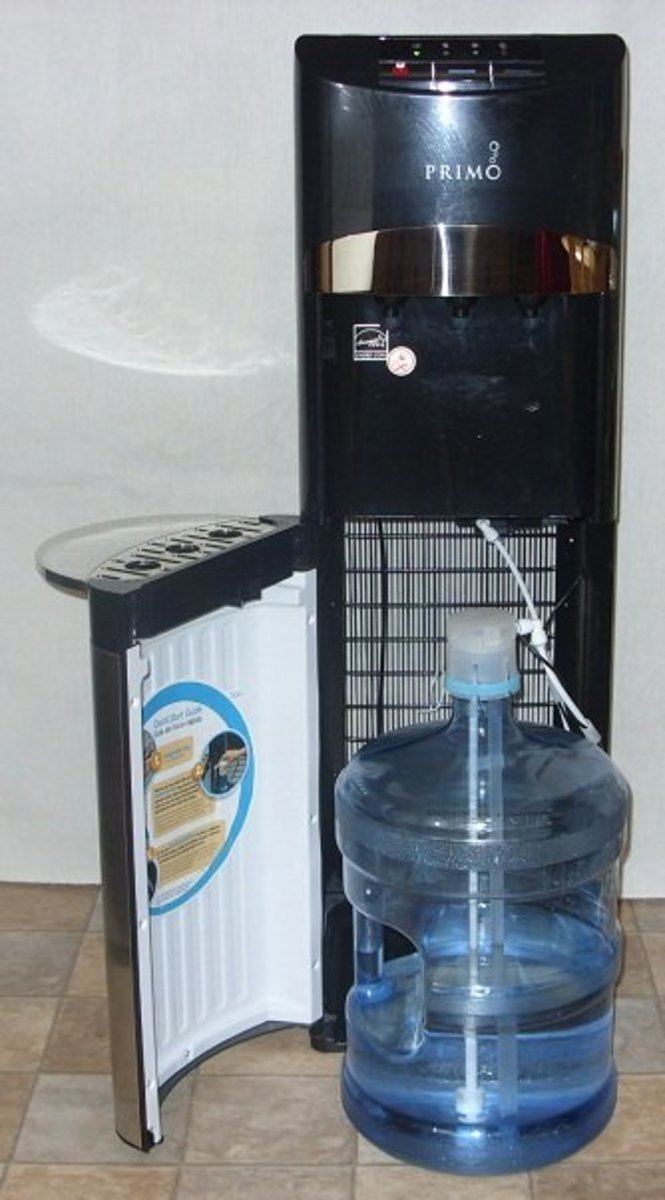 The water bottle fits inside on the bottom and water is siphoned up to the top for dispensing.