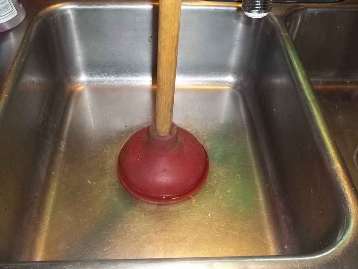 https://images.saymedia-content.com/.image/t_share/MTc0Mjk2NDEwNDc1Mjc2MTU2/how-to-unclog-a-double-kitchen-sink-drain-clogs-and-double-kitchen-sink-drains.jpg