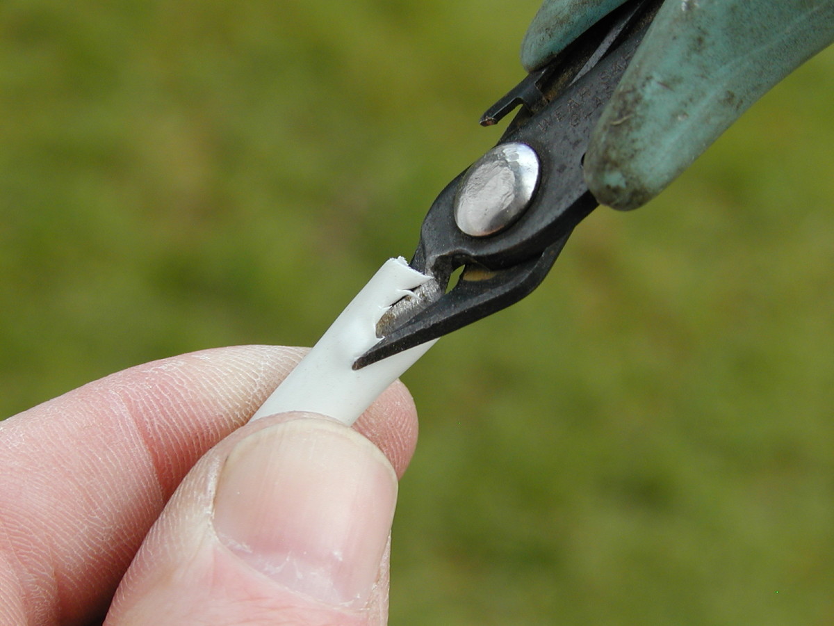 One way to remove the sheath is to snip down along the cable......