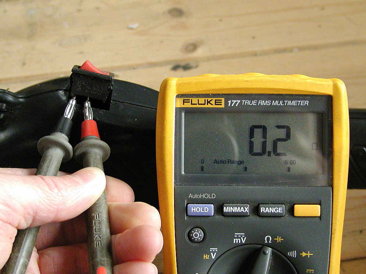 Set the meter to the "ohms" range. Resistance should be less than 1 ohm with the switch in the off position. Ideally you should detach one of the wires from the switch when testing.