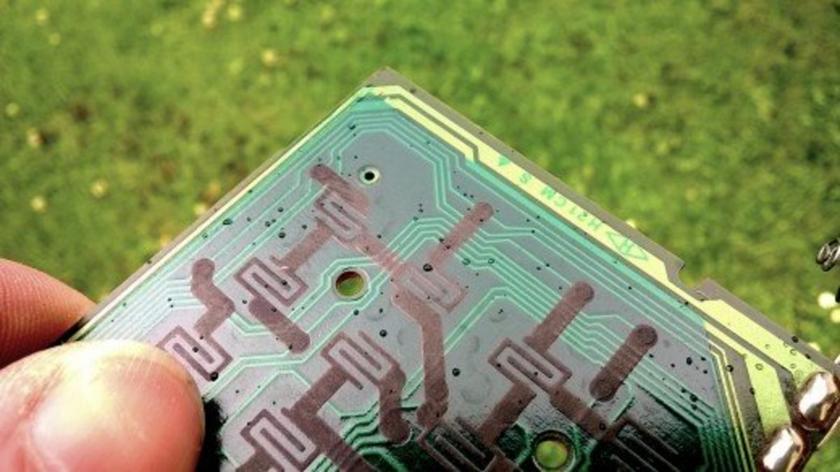 The conductive pads on the membrane make contact with copper contact pads on the PCB