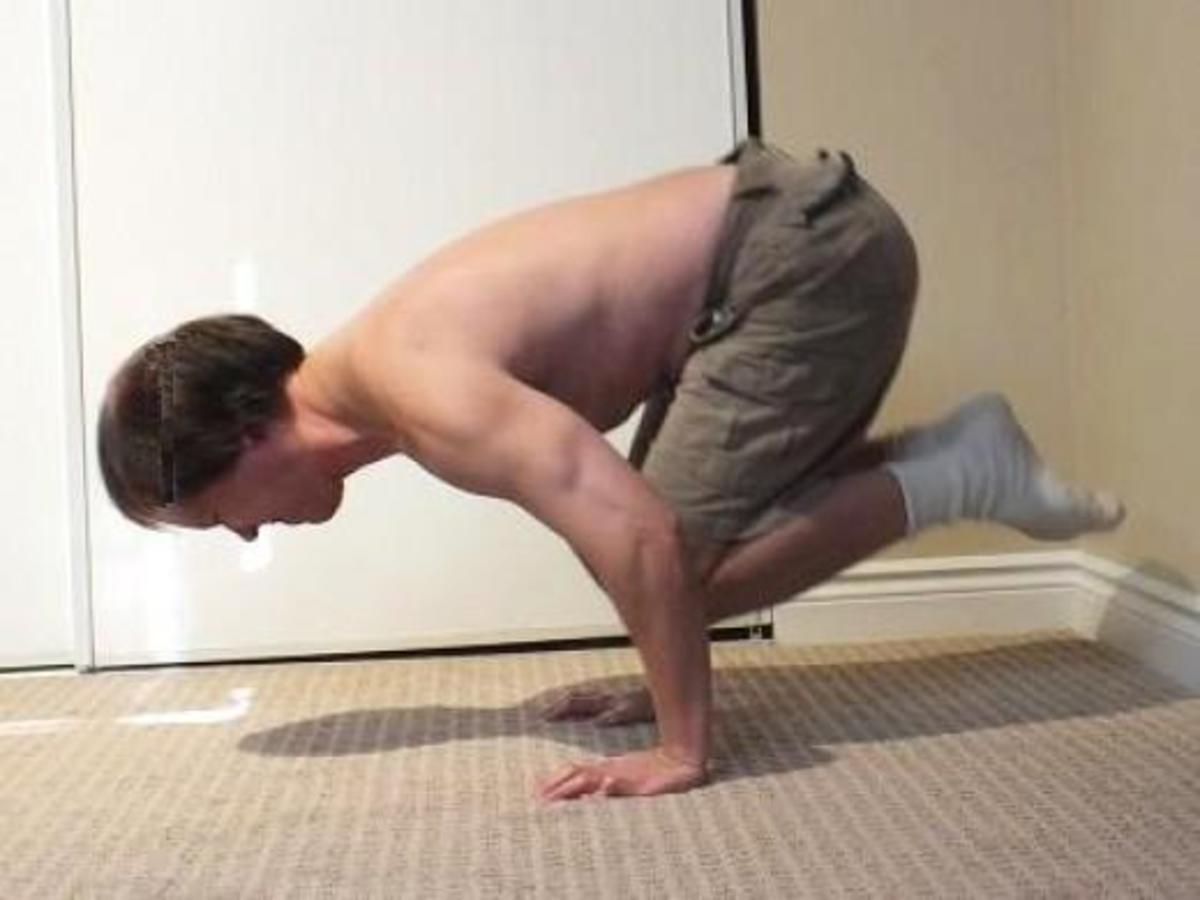 Challenging myself with tucked push-ups. The greater the effort the greater the reward.