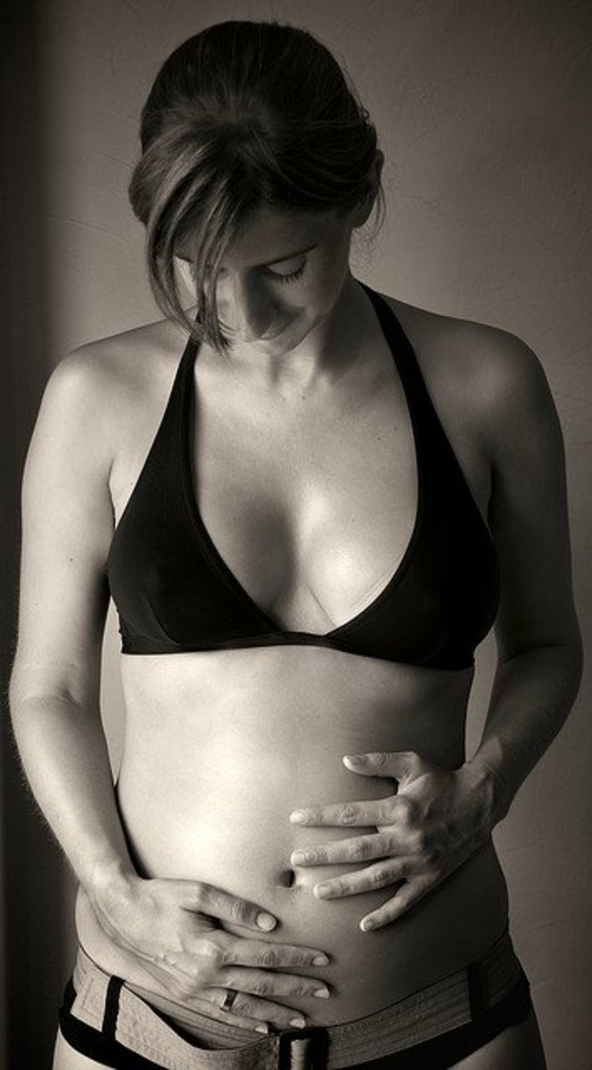 Pregnancy hormones stop the menstrual cycle by telling your body to nourish a baby instead.