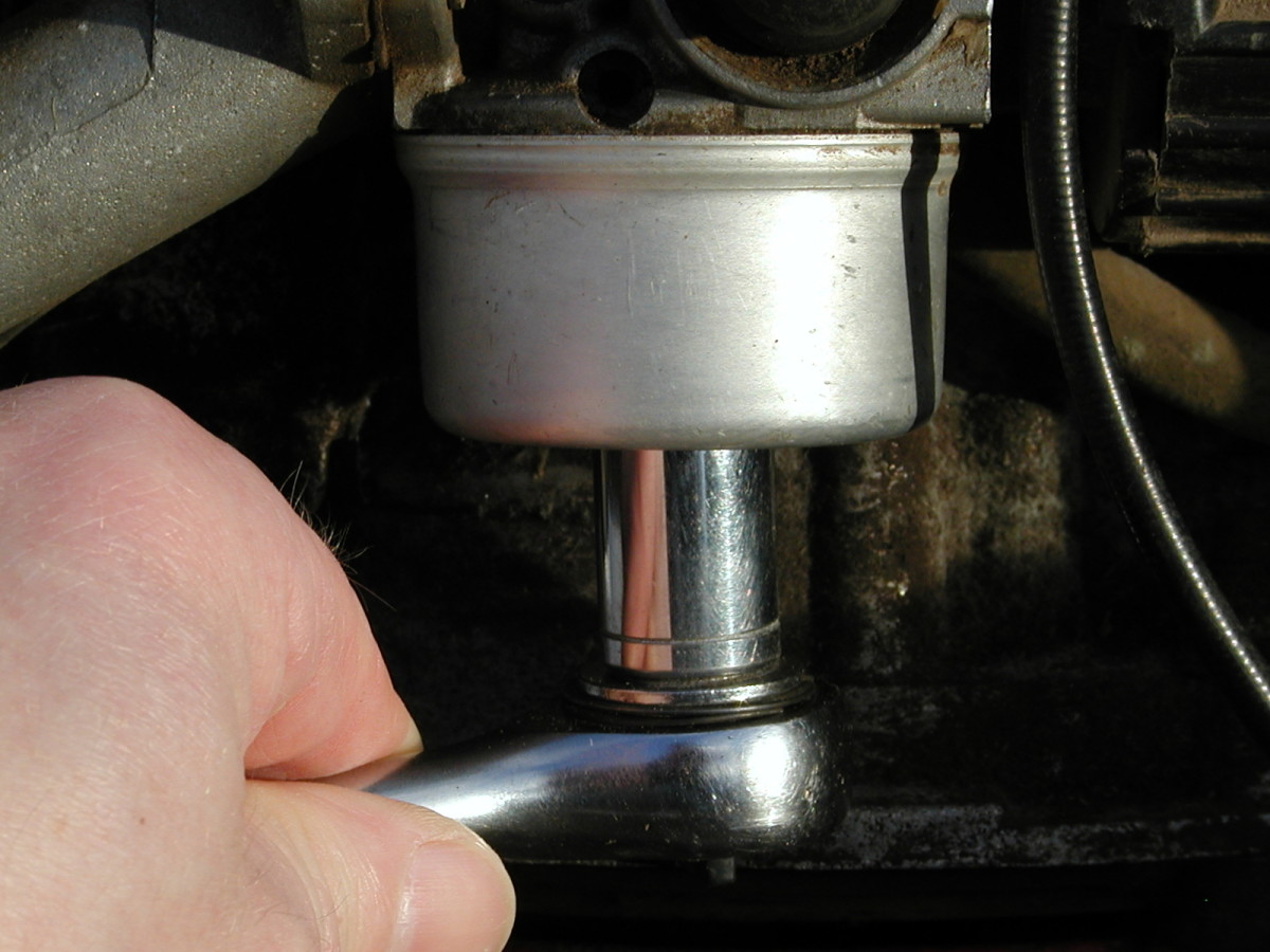 Remove bowl nut with socket wrench.
