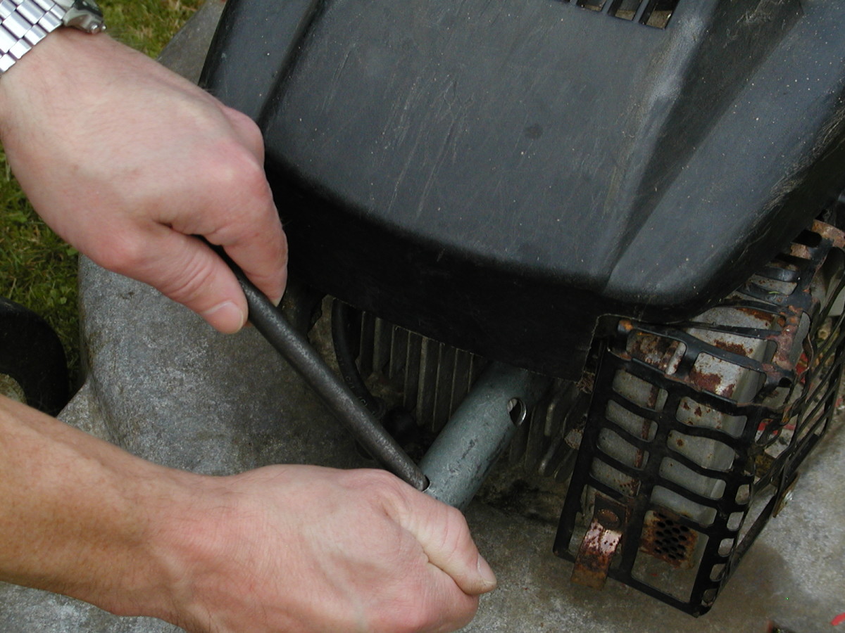 Removing the plug. Keep one hand on the plug wrench to stop it slipping off and damaging the spark plug.