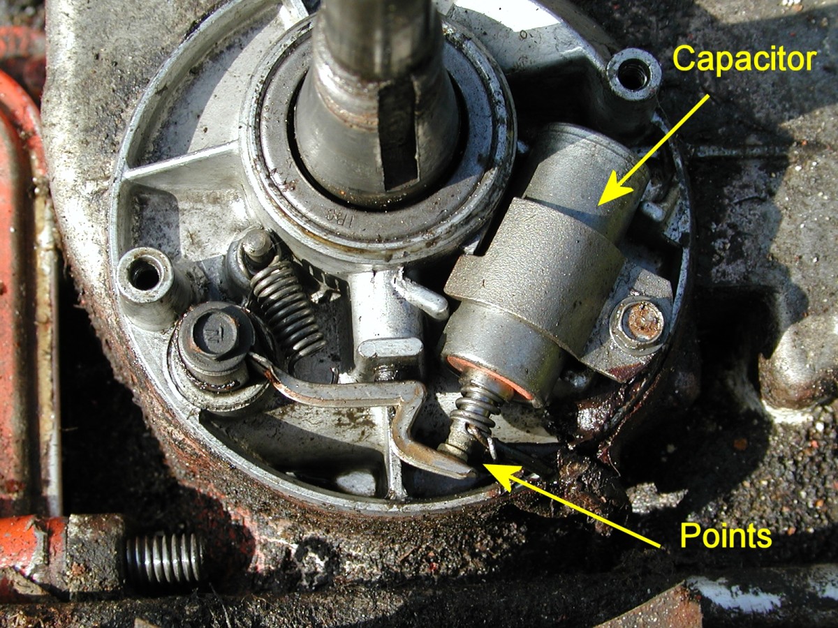 Points and capacitor (originally called a condenser): If the rubber seal on the crankshaft is faulty, oil can accumulate in this compartment and splash onto the points, causing misfiring.