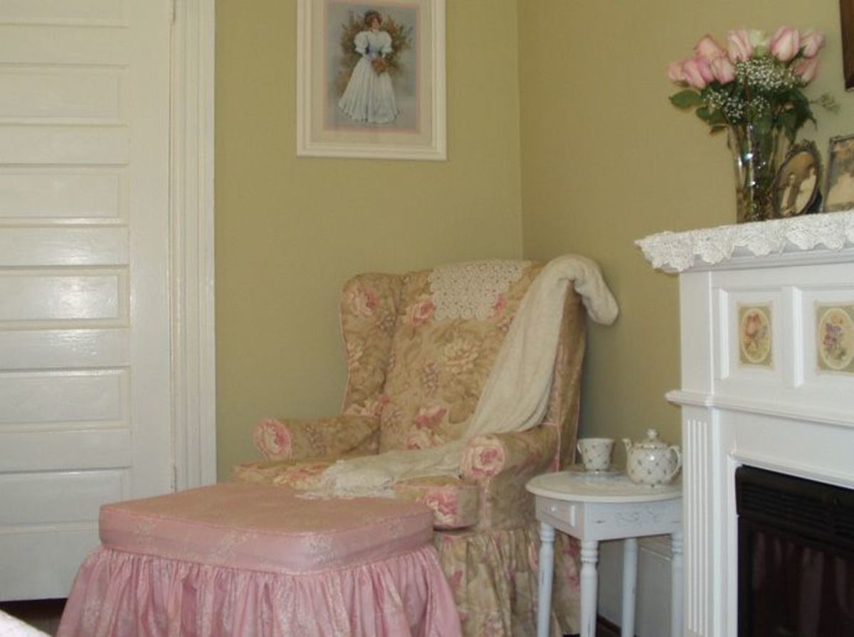 The cabbage rose fabric bought at the beginning of the decorating project was used for slipcovers for this chair.
