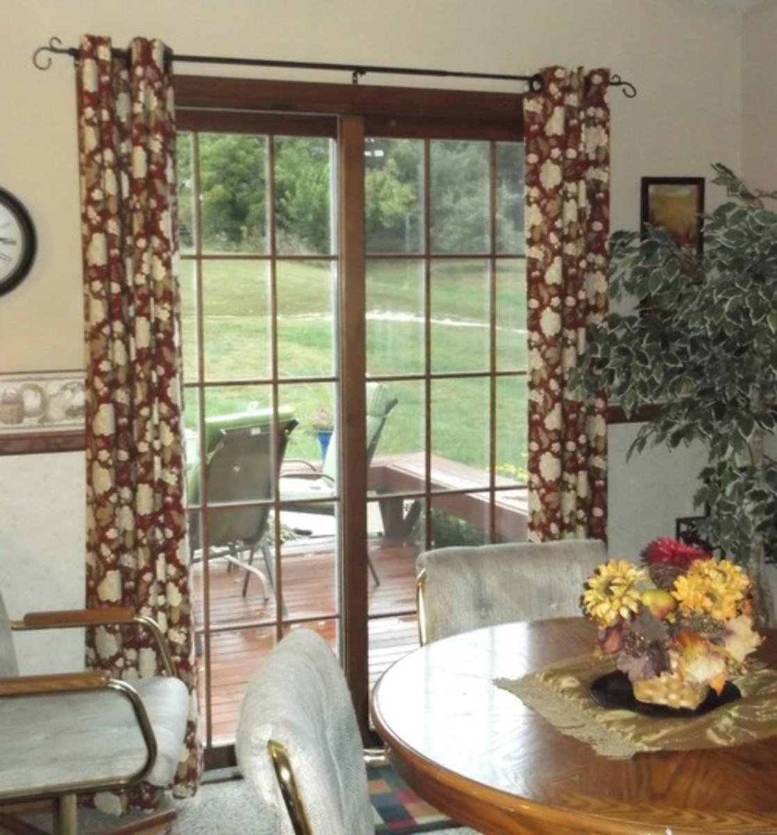 Make your own custom drapes with grommets that the rod passes through.