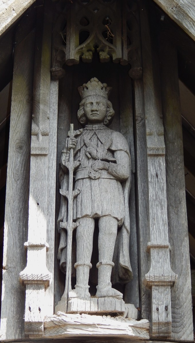 Carving of Saint Kenelm, local saint, found in the gateway to the church.