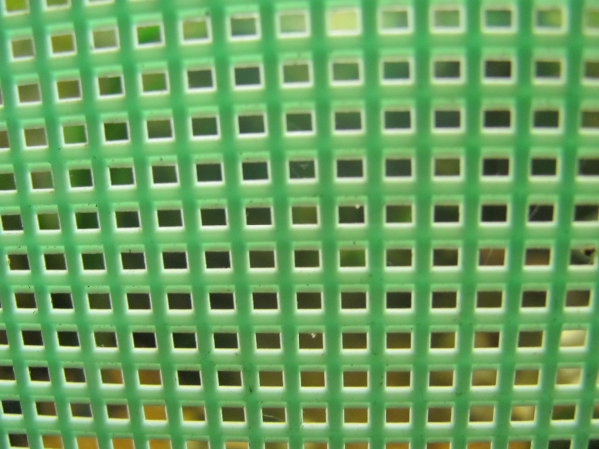 This is plastic canvas, also called plastic mesh. It has a surprising number of handy uses in aquariums.