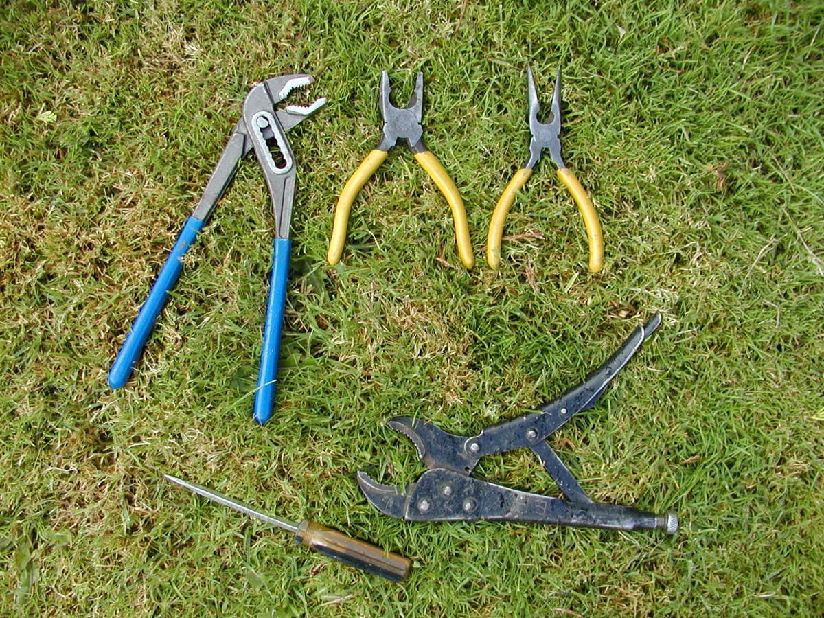 Clockwise from top - Water pump pliers, standard jaw pliers, long nose (snipe) pliers, curved jaw vise grips, flat blade screwdriver